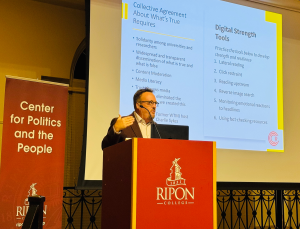 Prof. Michael Wagner on stage giving a talk at Ripon College.